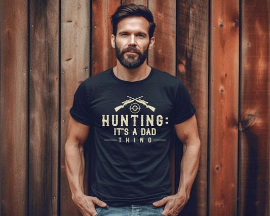 men wearing a black t-shirt saying Hunting it's a dad thing in light beige