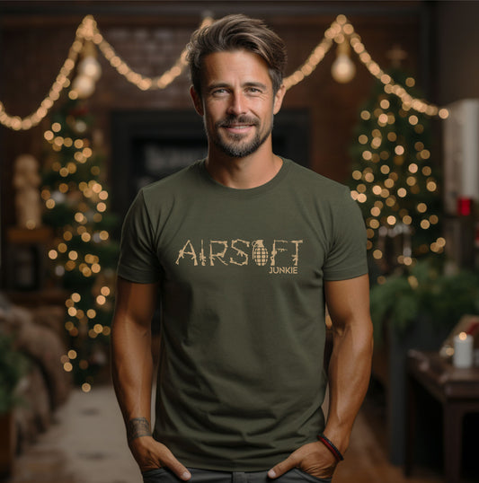 men wearing a military green t-shirt saying Airsoft Junkie in beige imprint, front of the shirt